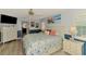 Inviting main bedroom with ample closet space, beach artwork, and a calming atmosphere at 5868 Jefferson Rd, Venice, FL 34293