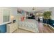 Serene main bedroom with natural light, pool access, and coastal-inspired decor at 5868 Jefferson Rd, Venice, FL 34293