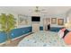 Bright main bedroom featuring a TV, decorative accents, and ensuite bathroom access at 5868 Jefferson Rd, Venice, FL 34293