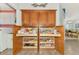 Walk-in pantry featuring custom built-in shelving for ample storage and easy organization at 5868 Jefferson Rd, Venice, FL 34293