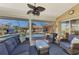 Comfortable covered patio overlooking the screened-in pool and waterfront views at 5868 Jefferson Rd, Venice, FL 34293