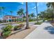 Beautiful street view featuring palm trees, blooming flowers, and quaint storefronts, capturing the essence of downtown Venice at 5868 Jefferson Rd, Venice, FL 34293