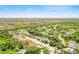 Residential community showcasing the layout of homes surrounded by green spaces and tree cover at 622 Pine Ranch East Rd, Osprey, FL 34229
