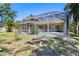 Backyard featuring a screened-in pool and patio at 622 Pine Ranch East Rd, Osprey, FL 34229