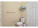 Bright bathroom features a toilet with towel racks, offering convenience and functionality at 622 Pine Ranch East Rd, Osprey, FL 34229