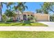 Stunning single-Gathering home showcasing lush landscaping and a charming exterior at 622 Pine Ranch East Rd, Osprey, FL 34229
