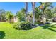 Well-kept lawn and lush landscaping complement this home's charming exterior at 622 Pine Ranch East Rd, Osprey, FL 34229
