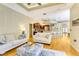Cozy living room with an open layout, comfortable sofas, and kitchen access at 622 Pine Ranch East Rd, Osprey, FL 34229
