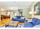 Open concept living room featuring hardwood floors and a dining space with bright, natural light at 622 Pine Ranch East Rd, Osprey, FL 34229