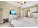 Spacious main bedroom featuring carpeted floors, a ceiling fan, and an ensuite bathroom at 622 Pine Ranch East Rd, Osprey, FL 34229