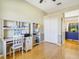 Bright office space with hardwood floors, a ceiling fan, and custom built in storage at 622 Pine Ranch East Rd, Osprey, FL 34229