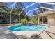 Sparkling screened-in pool surrounded by lush landscaping, creating a private oasis at 622 Pine Ranch East Rd, Osprey, FL 34229