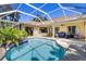 Relaxing screened-in pool area with comfortable seating, perfect for outdoor entertaining at 622 Pine Ranch East Rd, Osprey, FL 34229