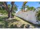 Well maintained yard enclosed by a long white fence, offering privacy at 622 Pine Ranch East Rd, Osprey, FL 34229