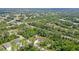 Expansive property nestled among lush trees in a quiet neighborhood offers ultimate privacy and seclusion at 66 Statler St, Port Charlotte, FL 33954