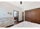 Light and airy bedroom with a dresser and closet at 66 Statler St, Port Charlotte, FL 33954