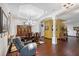 Formal dining room featuring hardwood floors, chandelier, and decorative columns at 66 Statler St, Port Charlotte, FL 33954