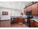 Updated kitchen featuring stainless-steel appliances, hardwood floors, and granite countertops at 66 Statler St, Port Charlotte, FL 33954