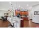Spacious kitchen with hardwood floors, granite countertops, and stainless-steel appliances at 66 Statler St, Port Charlotte, FL 33954