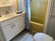 Cozy bathroom featuring single sink vanity, shower with curtain, and tile flooring at 6741 Laurel Ct, North Port, FL 34287