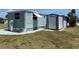 Exterior view of home with shed, providing ample outdoor storage space at 6741 Laurel Ct, North Port, FL 34287