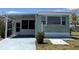 Cozy home featuring a covered patio, ample parking, and well-kept landscaping at 6741 Laurel Ct, North Port, FL 34287