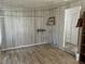 Open living room featuring decorative shelves, neutral walls, and tile flooring at 6741 Laurel Ct, North Port, FL 34287