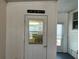 Interior detail showing the enclosed porch, a sign reading 