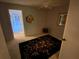 Cozy bedroom featuring neutral walls, a ceiling fan, and access to a hallway, creating a peaceful retreat at 7560 Fairway Woods Dr # 305, Sarasota, FL 34238