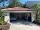 Two car garage includes covered vehicle and ample storage at 7560 Fairway Woods Dr # 305, Sarasota, FL 34238