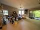 Inviting living room with vaulted ceiling, neutral color palette, and sliding glass doors to the screened porch at 7560 Fairway Woods Dr # 305, Sarasota, FL 34238