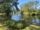 Relaxing water views featuring a pond and fountains and lush landscaping at 7560 Fairway Woods Dr # 305, Sarasota, FL 34238