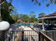 Enjoy poolside relaxation in this outdoor oasis, complete with ample seating and lush landscaping at 7560 Fairway Woods Dr # 305, Sarasota, FL 34238