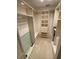 Well-organized walk-in closet featuring custom shelving, hanging rods, and ample storage space at 7560 Fairway Woods Dr # 305, Sarasota, FL 34238