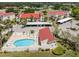 Aerial view of condo community featuring manicured lawns and the community pool at 770 Village Cir # 232, Venice, FL 34292