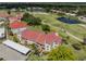 Scenic aerial view of condos near a golf course with ponds, offering a serene and recreational lifestyle at 770 Village Cir # 232, Venice, FL 34292