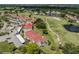 Scenic aerial view of the condo buildings, golf course, parking and landscaping at 770 Village Cir # 232, Venice, FL 34292