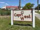 Capri West community sign with landscaping in front of the building complex, offering a welcoming entrance at 770 Village Cir # 232, Venice, FL 34292