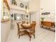 Bright dining room with a round table and chairs, and views into the kitchen at 770 Village Cir # 232, Venice, FL 34292