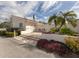 Charming clubhouse with palm trees and meticulous landscaping, offering a relaxing atmosphere at 770 Village Cir # 232, Venice, FL 34292
