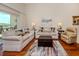 Cozy living room features modern decor, plush seating, and lots of light at 770 Village Cir # 232, Venice, FL 34292