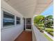 Covered patio featuring sliding doors, a welcome mat, and a view of the community at 770 Village Cir # 232, Venice, FL 34292