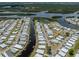 Aerial view shows a quiet neighborhood with lake access through a network of canals at 798 Fairmount Dr, North Port, FL 34287