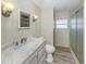 A clean bathroom featuring a modern vanity, contemporary fixtures, and a walk-in shower at 798 Fairmount Dr, North Port, FL 34287