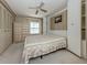 Comfortable bedroom with built-in closets, wood look flooring, and natural light at 798 Fairmount Dr, North Port, FL 34287