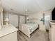 Spacious bedroom featuring a bed, ceiling fan, and convenient closet storage at 798 Fairmount Dr, North Port, FL 34287
