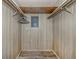 Walk in closet with dual clothes racks and lighting at 798 Fairmount Dr, North Port, FL 34287