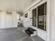 Welcoming entryway with a covered porch, offering easy access to the home at 798 Fairmount Dr, North Port, FL 34287