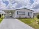 Charming single-story home with a covered carport and well-maintained landscaping at 798 Fairmount Dr, North Port, FL 34287