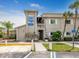 Waterfront community with gray exterior, tropical landscaping, and signage at 798 Fairmount Dr, North Port, FL 34287